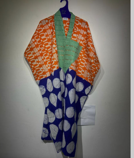 orange tribal multicolour midi agbada with blue and white polka bottom and asooke neck