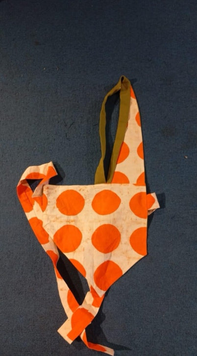 tangerine and white polka reversible bib
