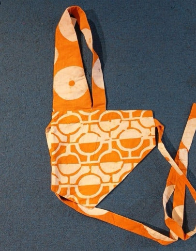 orange and white tile bib